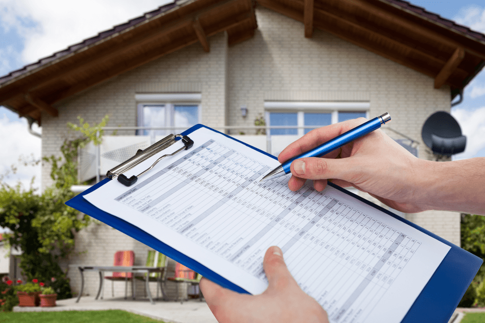 factors that impact inspection scheduling inspector holding a clipboard Custom Built Lansing Michigan