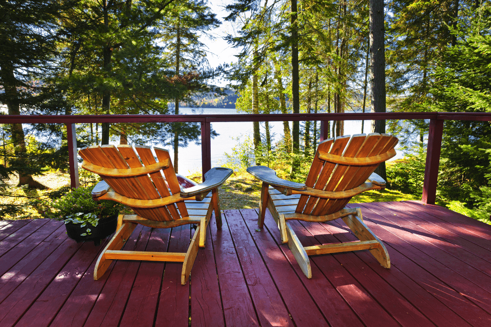 top 5 deck builders in Boyne City Michigan two chairs on lakefront home Custom Built