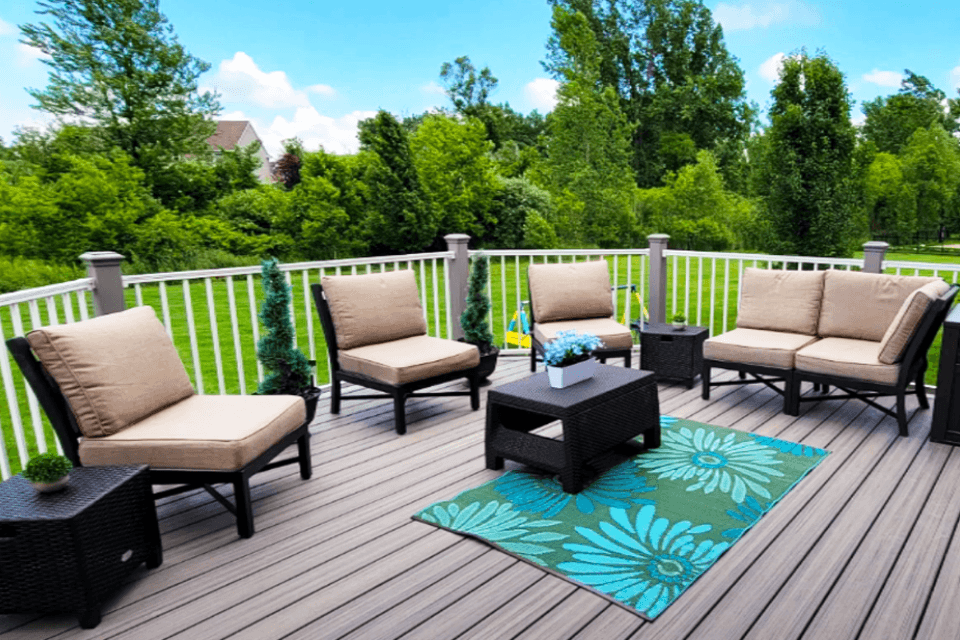 composite decking outdoor living space with chairs and topiaries custom built lansing michigan