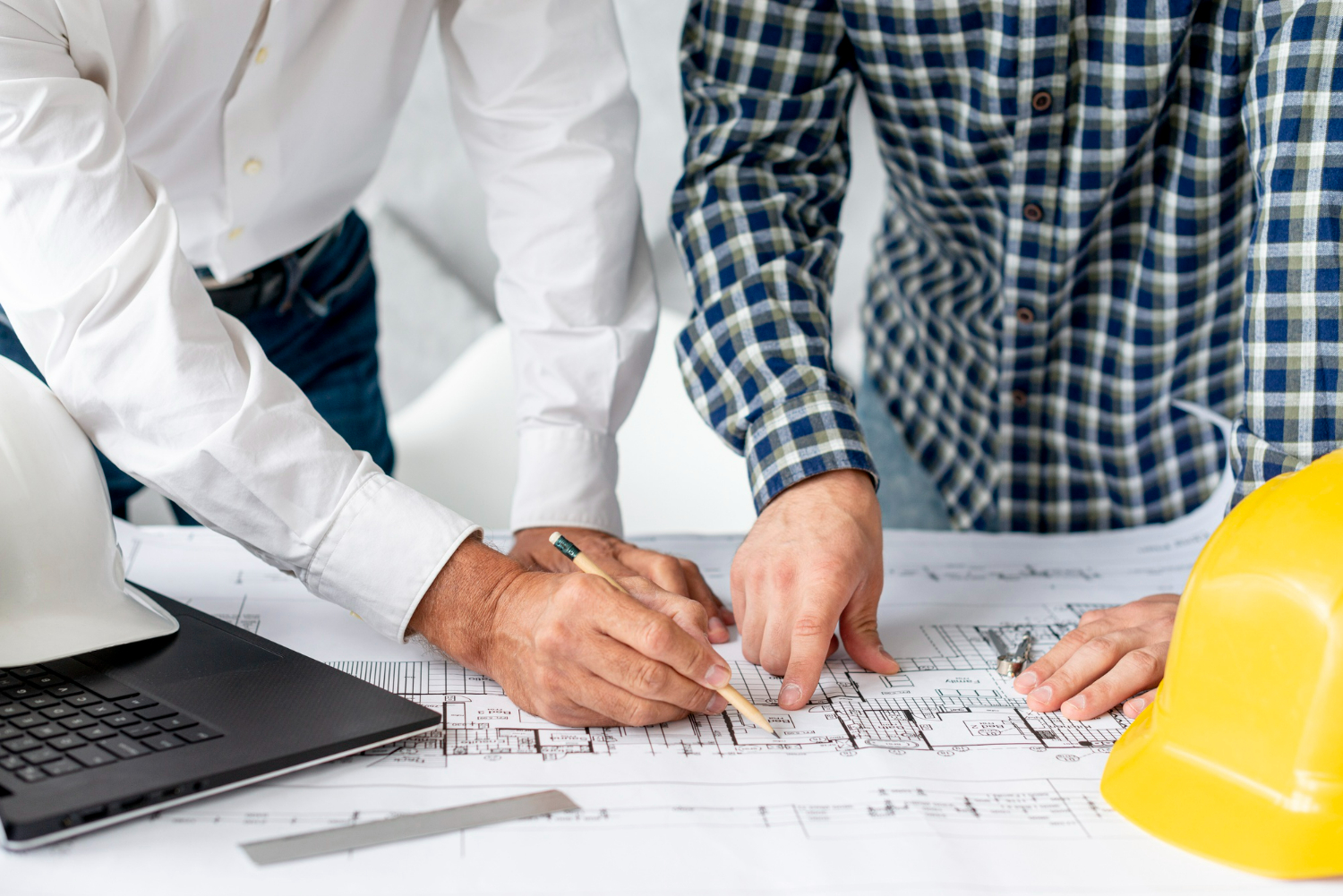 People looking over building plans