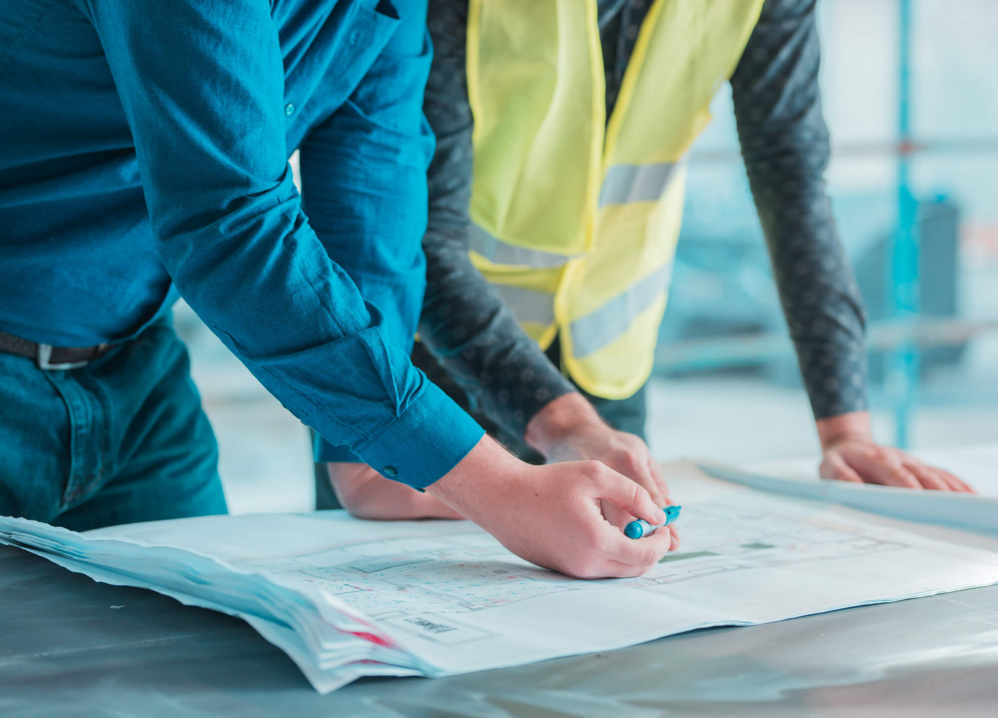 Construction contractors looking over plans