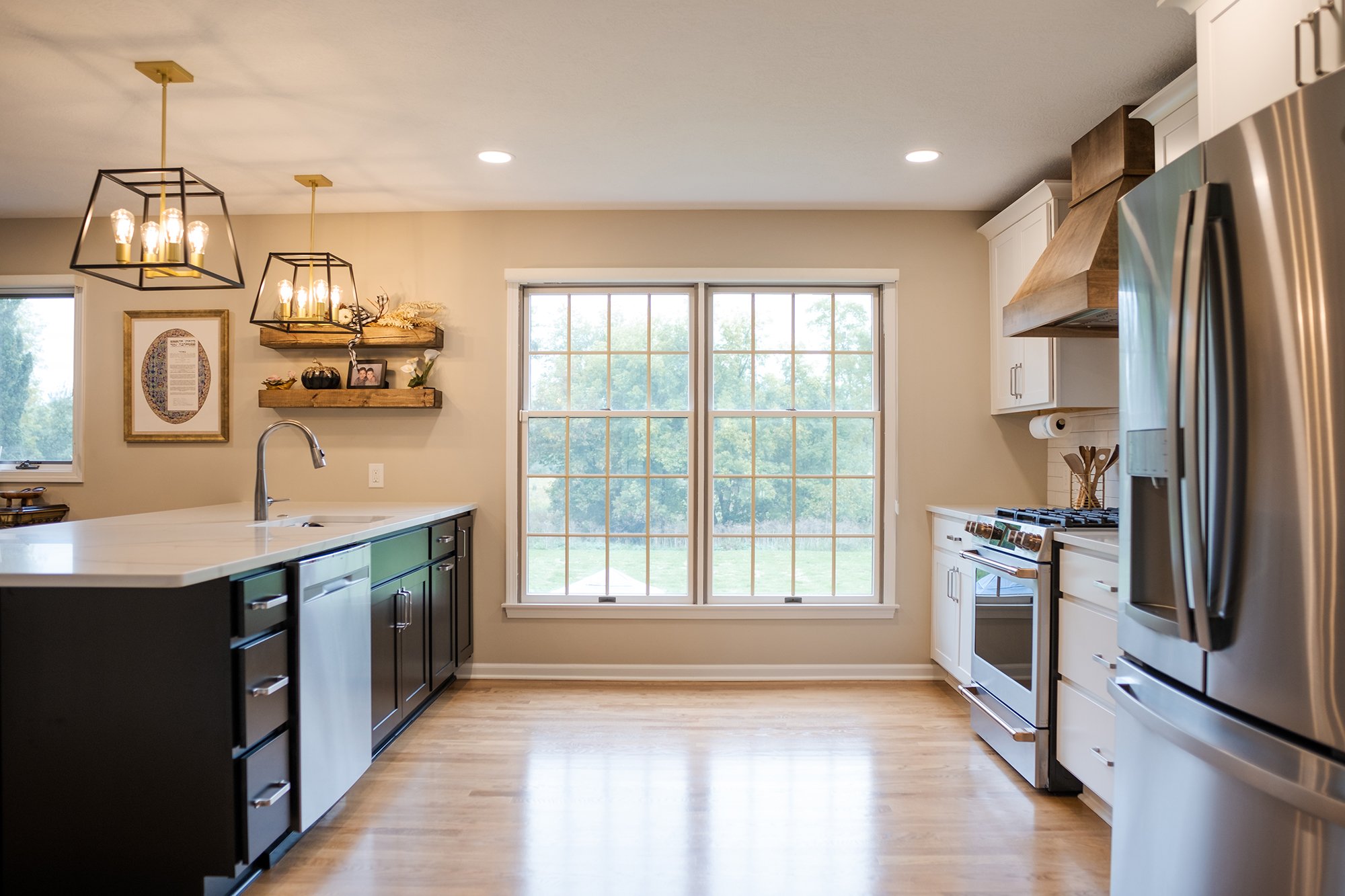Remodeled kitchen with updated appliances and a large window